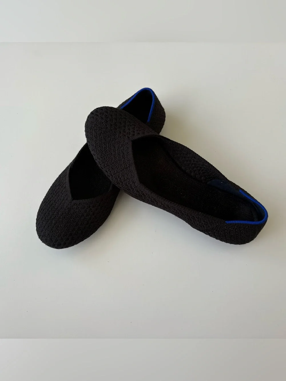 Rothy's Black Knit Ballet Flats with Blue Heel Trim. Womens size 7.5